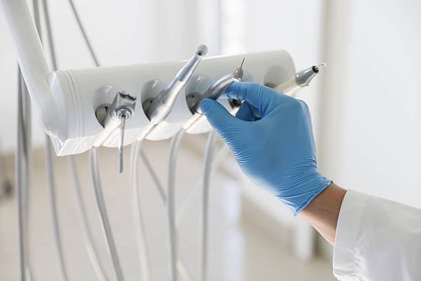 Professional Tooth Extraction technician working in Beach City, TX